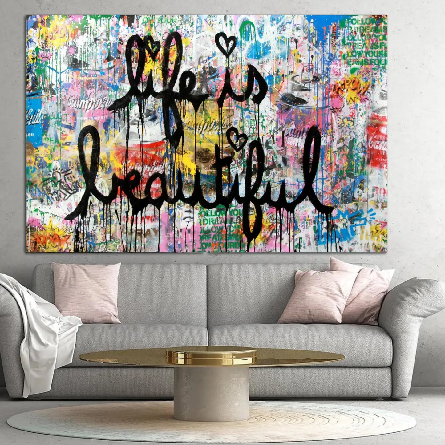 Colorful abstract wall art with 'Life is Beautiful' text in a living room.