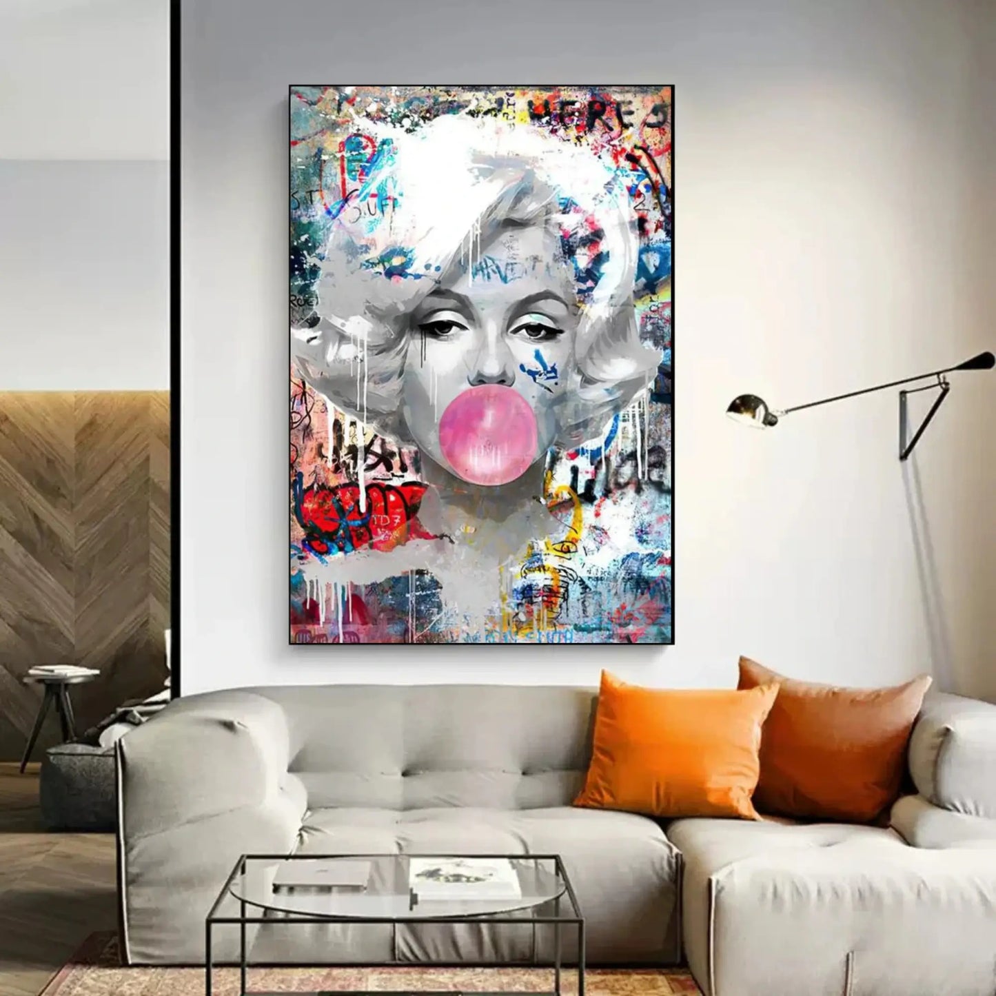 Colorful abstract painting of a face with a bubble gum bubble on a wall above a sofa.