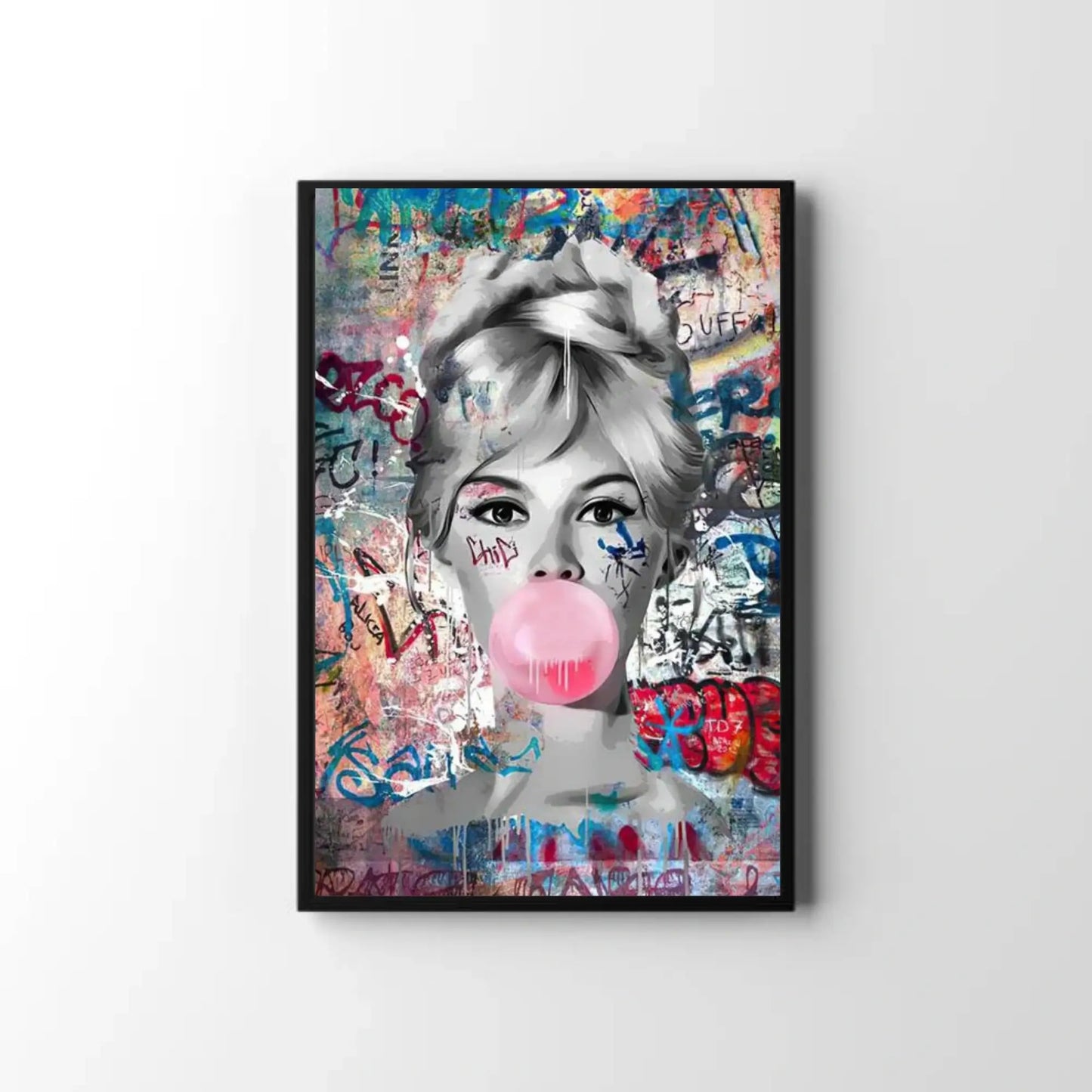 Framed artwork of a woman blowing a bubble with gum against a colorful graffiti background.