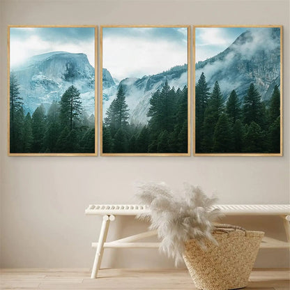 Three framed mountain landscape pictures on a wall above a bench with decorative items.