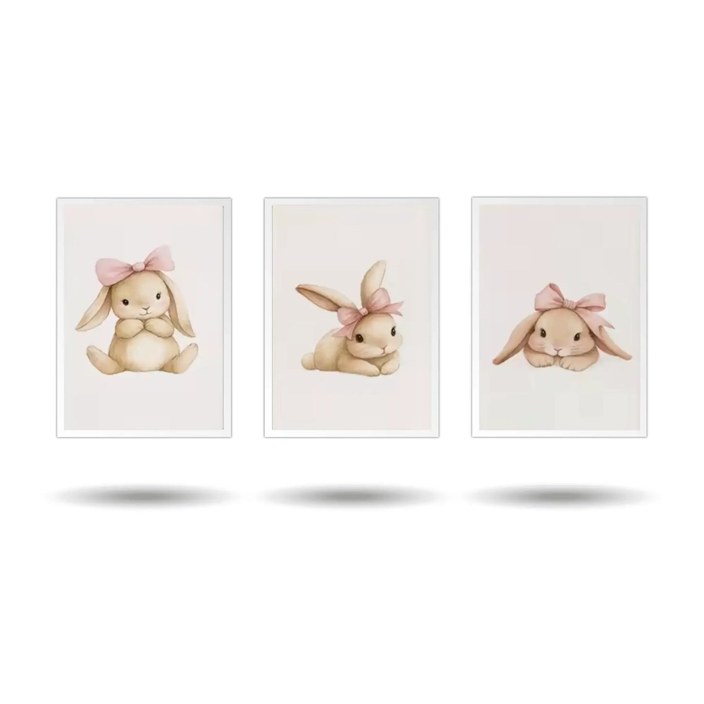 A set of three minimalist rabbit wall art prints for a baby nursery. The framed art features a seated bunny, a bunny with a flower, and a playful bunny on a white background.