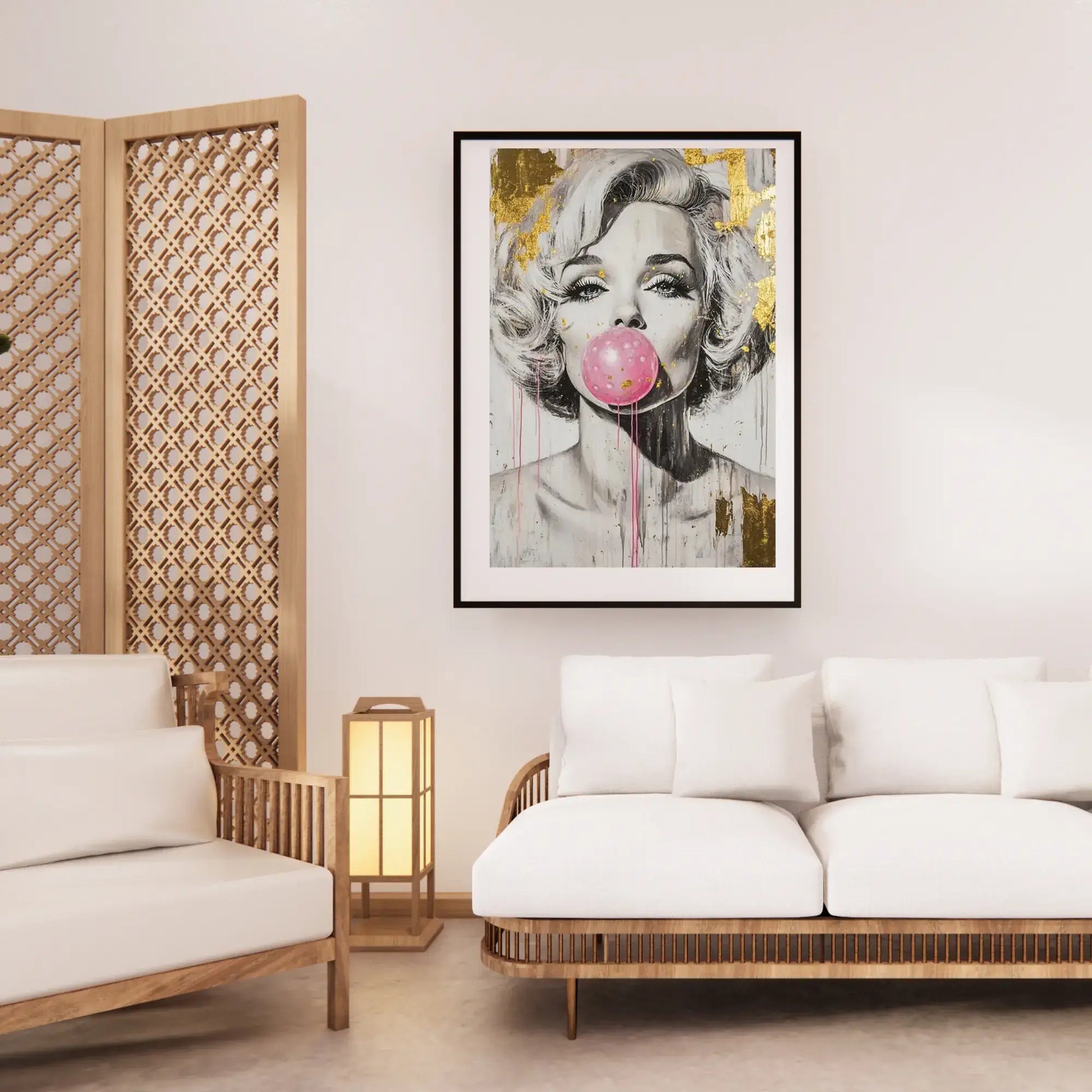 Living room with a framed artwork of a woman blowing a pink bubble gum bubble, wooden screen, and white sofa.