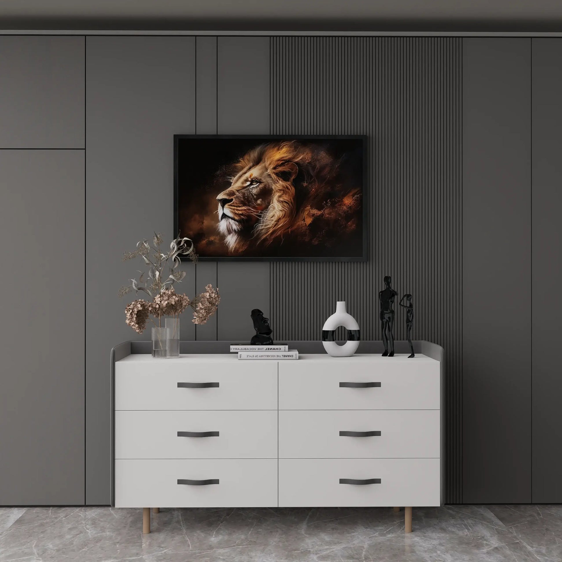 White dresser with decorative items against a dark wall with a framed lion painting.