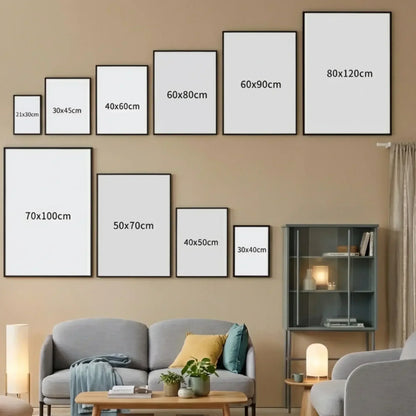 Wall with various photo frame sizes displayed against a beige wall with a living room setup.