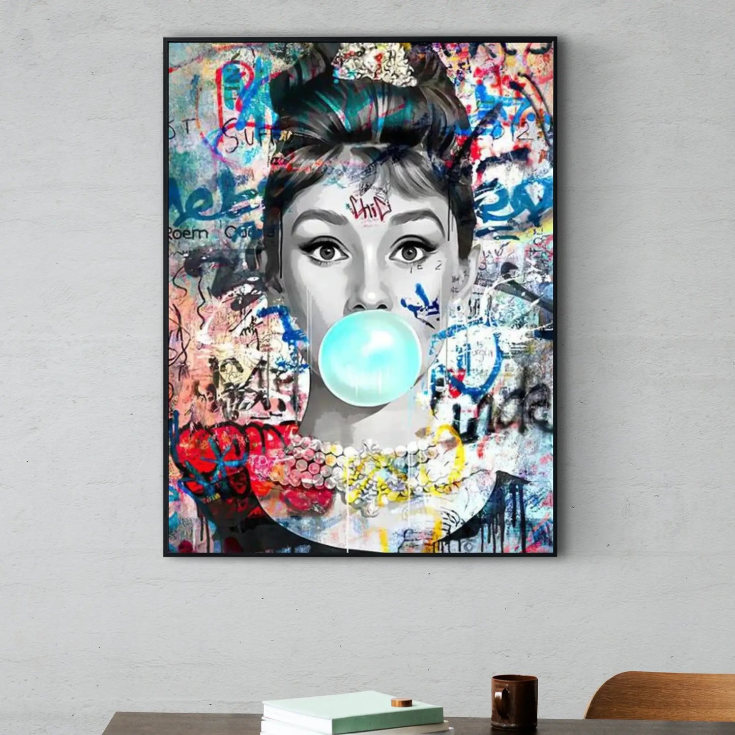 Framed artwork of a woman blowing a bubble with colorful graffiti-style background